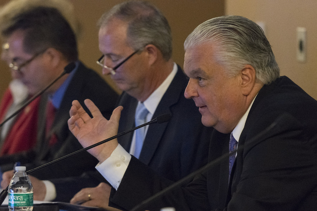 Southern Nevada Tourism Infrastructure committee member Steve Sisolak, right, speaks during a Southern Nevada Tourism Infrastructure committee meeting at UNLV in Las Vegas to discuss the proposed  ...