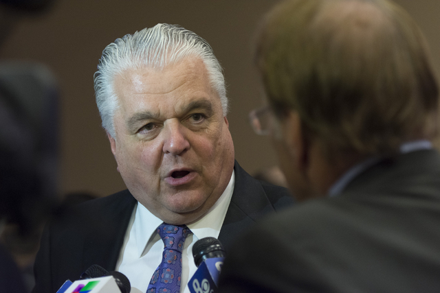 Southern Nevada Tourism Infrastructure committee member Steve Sisolak speaks with news media following a Southern Nevada Tourism Infrastructure committee meeting at UNLV in Las Vegas to discuss th ...