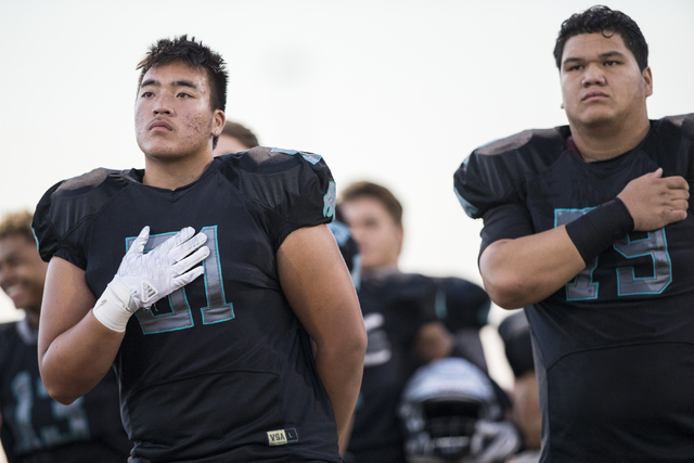 Silverado players observe the National Anthem before the start of the Skyhawks home matchup with the Faith Lutheran Crusaders on Friday, Sept. 16, 2016, at Silverado High School, in Las Vegas. Ben ...