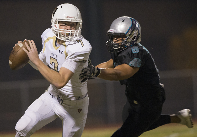 Faith Lutheran quarterback Sagan Gronauer (7) scrambles away from Silverado strong safety Pekelo Solomon (8) during the Crusaders road matchup with the Skyhawks on Friday, Sept. 16, 2016, at Silve ...