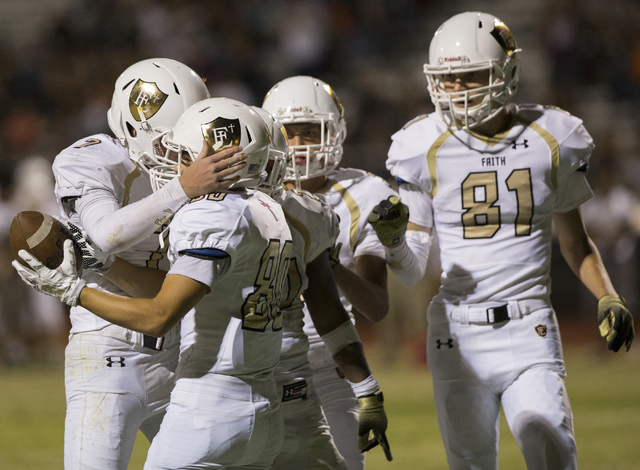 Faith Lutheran wide receiver Eric Ho (80) celebrates with teammates after scoring a second quarter touchdown during the Crusaders road matchup with the Skyhawks on Friday, Sept. 16, 2016, at Silve ...