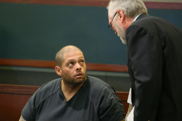 Pedro Jose Garcia, 34, left, speaks with Deputy Public Defender Edward Kane at the Regional Justice Center Friday, Sept. 30, 2016, in Las Vegas. Garcia is charged in the shooting death of Aleksand ...