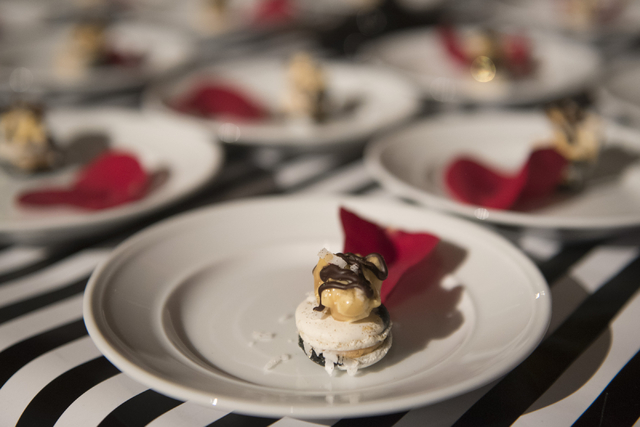 Pastry chef with Kailua Kaiulani Delgado's dessert entry is seen during the Girl Scouts of Southern Nevada &quot;Dessert Before Dinner&quot; charity event at Caesars Palace hotel-casino in ...
