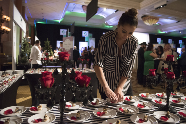 Pastry chef with Kailua Kaiulani Delgado organizes her dessert entry during the Girl Scouts of Southern Nevada &quot;Dessert Before Dinner&quot; charity event at Caesars Palace hotel-casin ...