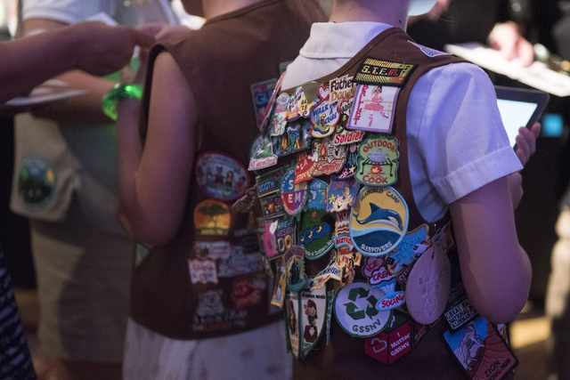Merit badges are seen on girl scout uniforms during the Girl Scouts of Southern Nevada "Dessert Before Dinner" charity event at Caesars Palace hotel-casino in Las Vegas, Saturday ...
