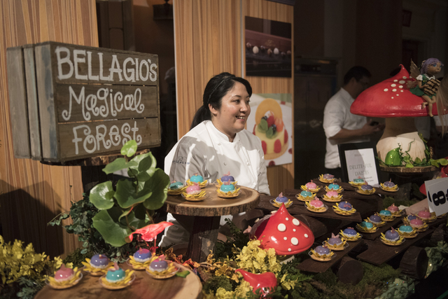 Pastry chef with Bellagio hotel-casino Kaori Scott speaks with guests about her dessert entry during the Girl Scouts of Southern Nevada &quot;Dessert Before Dinner&quot; charity event at C ...