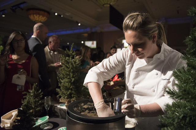 Pastry chef with MGM Grand hotel-casino Kimberly Vitou prepares her dessert entry during the Girl Scouts of Southern Nevada &quot;Dessert Before Dinner&quot; charity event at Caesars Palac ...