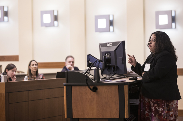 Dr. Erika Marquez, director of social policy for the Kenny Guinn Center for Policy Priorities, speaks at a gun reform presentation at the William S. Boyd School of Law at UNLV on Wednesday, Sept.  ...
