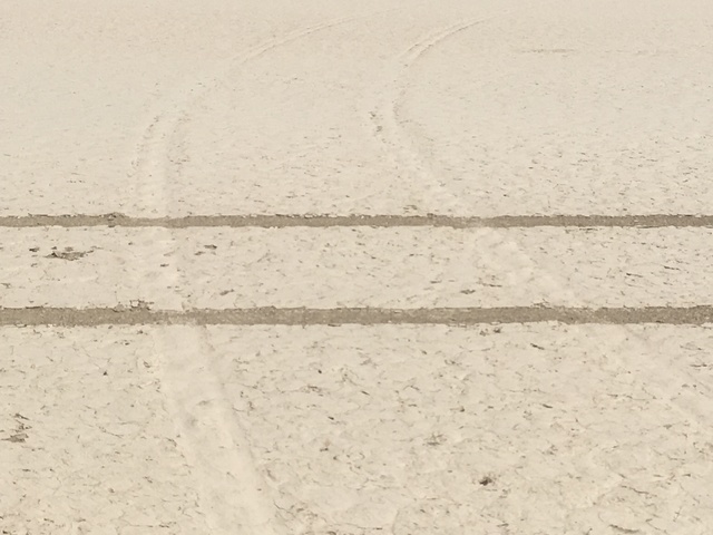 Fresh tire tracks cross the scars left by a previous illegal excursion onto Racetrack Playa in Death Valley National Park. Motor vehicles are prohibited on the dry lake bed, where damage from tire ...
