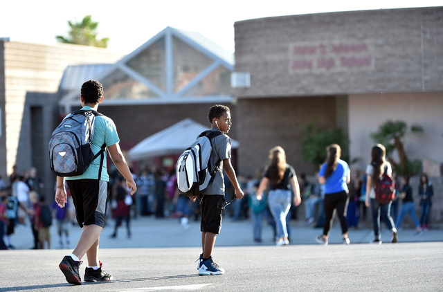 Students arrive at Johnson Junior High School Tuesday, Sept. 13, 2016, in Las Vegas. The school reopened after being closed for a mercury contamination cleaning since Thursday. (David Becker/Las V ...