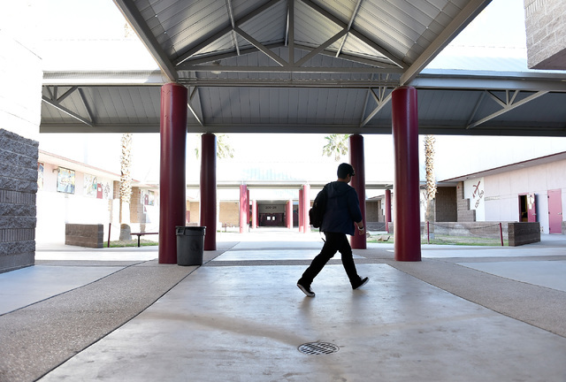 A student walks across the campus at Johnson Junior High School Tuesday, Sept. 13, 2016, in Las Vegas. The school reopened after being closed for a mercury contamination cleaning since Thursday. D ...