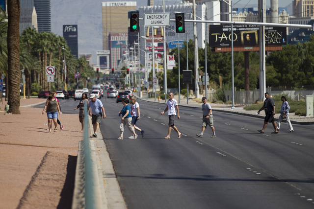 People cross Las Vegas Boulevard South toward the Welcome to Fabulous Las Vegas sign on Wednesday, Aug. 31, 2016, in Las Vegas. (Erik Verduzco/Las Vegas Review-Journal Follow @Erik_Verduzco)