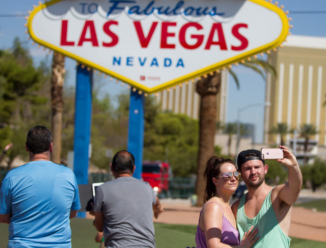 Anna Collins, left, and her fiancé, Adam Loughgran, of England take a photo in front of the Welcome to Fabulous Las Vegas sign on Wednesday, Aug. 31, 2016, in Las Vegas. (Erik Verduzco/Las Vegas  ...