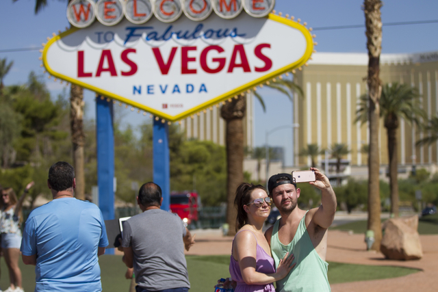 Anna Collins, left, and her fiancé, Adam Loughgran, of England take a photo in front of the Welcome to Fabulous Las Vegas sign on Wednesday, Aug. 31, 2016, in Las Vegas. (Erik Verduzco/Las Vegas  ...