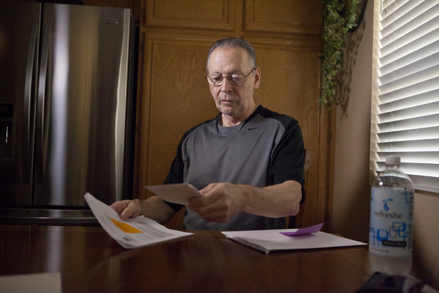 Marine veteran Richard Zaccara looks over his medical paperwork at his home in Henderson on Tuesday, Aug. 30, 2016. Zaccara was diagnosed with leukemia in 2003 as a result of being exposed to toxi ...