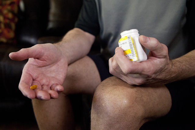 Marine veteran Richard Zaccara holds up his leukemia medication at his home in Henderson on Tuesday, Aug. 30, 2016. Zaccara was diagnosed with leukemia in 2003 as a result of being exposed to toxi ...