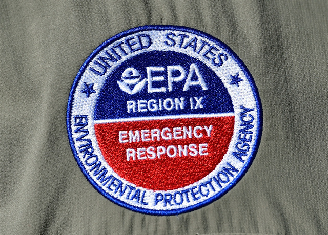 A logo for the Environmental Protection Agency emergency response is seen at a news conference at Walter Johnson Junior High School Monday, Sept. 12, 2016, in Las Vegas. The school is scheduled to ...