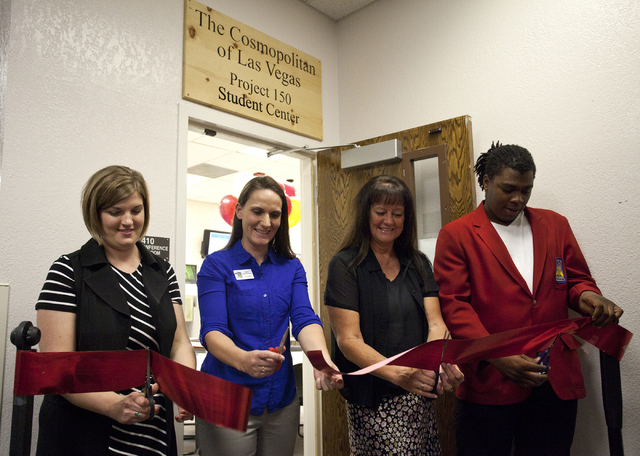 From left, Leah Miller, Brooke Allen-Burnstein, Dr. Tammy Malich and Charles Blackwell cut the ribbon during the grand opening of the new student center at Desert Rose High School in North Las Veg ...