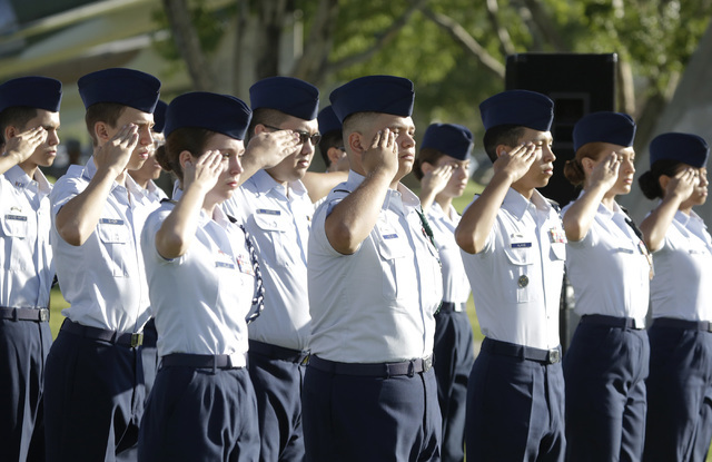 Air Force Junior ROTC cadets from Rancho High School salut during the national anthem during the annual National POW-MIA Recognition Day ceremony Friday, Sept 16, 2016, at Nellis Air Force Base. B ...