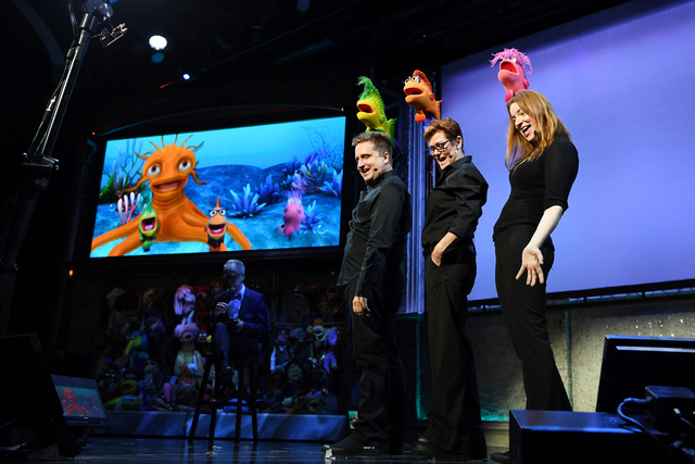 From left, Grant Baciocco, Peggy Etra and Colleen Smith perform in &quot;Puppet Up!&quot; as Patrick Bristow, seated, serves as host. (Denise Truscello)