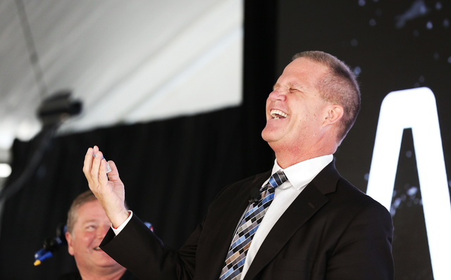 Mark Hutchison, right, Nevada Lieutenant Governor, shares a laugh on stage with Sam Schmidt at Exotics Racing on Wednesday, Sept. 28, 2016, in Las Vegas. Schmidt is the first person in the country ...
