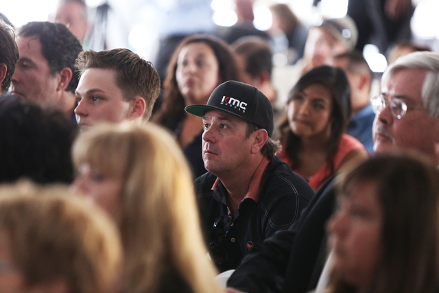 Las Vegas racing legend Jimmy Vasser listens to Sam Schmidt speak at Exotics Racing on Wednesday, Sept. 28, 2016, in Las Vegas. Schmidt is the first person in the country to receive a restricted d ...