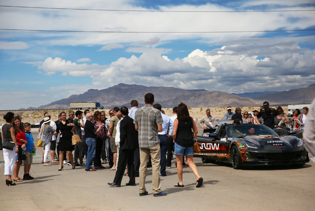 Sam Schmidt, in car, interacts with friends and media after completing a test run in his modified Corvette at Exotics Racing on Wednesday, Sept. 28, 2016, in Las Vegas. Schmidt is the first person ...