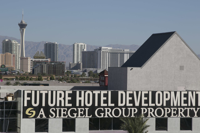 A sign promising a future development hangs on the former Atrium Suites Hotel property located at 4255 Paradise Road in Las Vegas, Wednesday, Sept. 14, 2016. (David Becker/Las Vegas Review-Journal ...