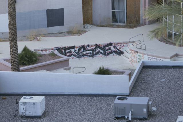 Graffiti is seen in the empty pool of the former Atrium Suites Hotel property located at 4255 Paradise Road in Las Vegas, Wednesday, Sept. 14, 2016. (David Becker/Las Vegas Review-Journal) Follow  ...