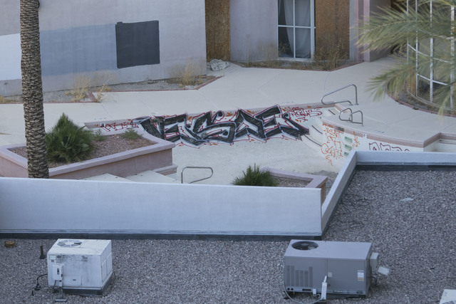 Graffiti is seen in the empty pool of the former Atrium Suites Hotel property located at 4255 Paradise Road in Las Vegas, Wednesday, Sept. 14, 2016. (David Becker/Las Vegas Review-Journal) Follow ...