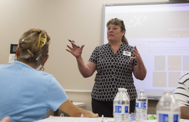 Kathy Carrico, training director for the Nevada Small Business Development Center, lectures to those attending the NxLeveL for Entrepreneurs small business course at the Urban Chamber of Commerce  ...