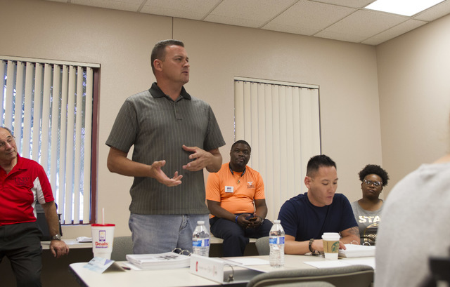 Murray Hickman III, owner of Diversified Communications Solutions Inc., introduces himself during the NxLeveL for Entrepreneurs small business course at the Urban Chamber of Commerce in Las Vegas ...