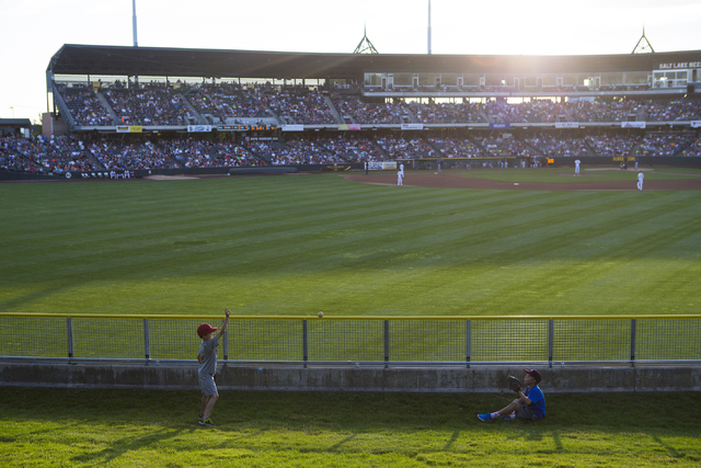 Children play catch as a baseball game goes on between the Salt Lake Bees and Las Vegas 51s at Smith's Ballpark in Salt Lake City on Monday, June 20, 2016. (Chase Stevens/Las Vegas Review-Journal) ...