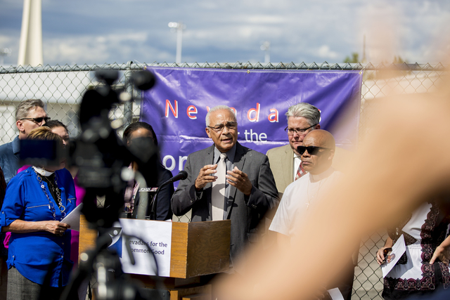 Charles Redmon, member of University United Methodist Church, speaks on behalf of Nevadans for the Common Good regarding their &quot;Seven Hidden Risks in the Stadium Plan&quot; outside of ...