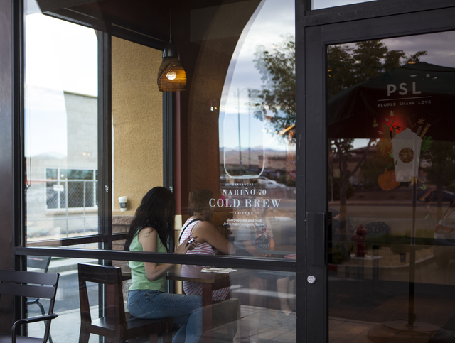 Patrons sit inside Starbucks at 7260 S. Rainbow Blvd. in Las Vegas on Tuesday, Sept. 27, 2016. A fatal shooting broke out inside the coffee shop on Sunday, Sept. 25, 2016. Miranda Alam/Las Vegas R ...
