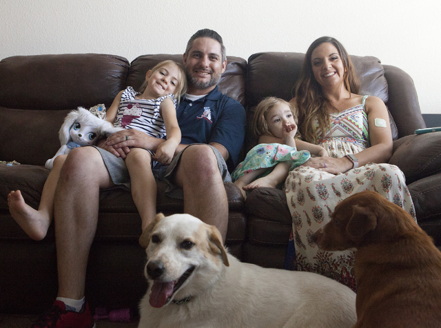 Army veteran Randy Dexter poses with his family at their home in Henderson on Friday, Sept. 2, 2016. Dexter suffered traumatic brain injury (TBI) while in the Army and now is part of public awaren ...