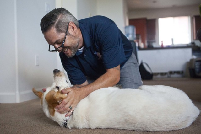 Army veteran Randy Dexter plays with his service dog, Champion, at their home in Henderson on Friday, Sept. 2, 2016. Dexter suffered traumatic brain injury (TBI) while in the Army and now is part  ...