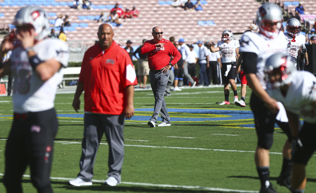 UNLV Rebels head coach Tony Sanchez, center, walks the field as his team warms up ahead of a football game against UCLA at the Rose Bowl in Pasadena, Calif. on Saturday, Sept. 10, 2016. Chase Stev ...