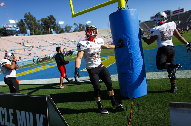 UNLV Rebels tight end Kyle Anderson (49) and linebacker Kyler O'Halloran (50) stretch ahead of a football game against UCLA at the Rose Bowl in Pasadena, Calif. on Saturday, Sept. 10, 2016. Chase  ...