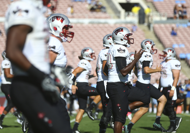 UNLV players warm up ahead of a football game against UCLA at the Rose Bowl in Pasadena, Calif. on Saturday, Sept. 10, 2016. Chase Stevens/Las Vegas Review-Journal Follow @csstevensphoto
