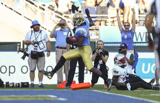 UCLA Bruins running back Soso Jamabo (9) scores a touchdown against UNLV during a football game at the Rose Bowl in Pasadena, Calif. on Saturday, Sept. 10, 2016. Chase Stevens/Las Vegas Review-Jou ...