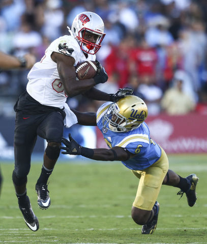 UNLV Rebels wide receiver Devonte Boyd (83) gets past UCLA Bruins defensive back Adarius Pickett (6) during a football game against UCLA at the Rose Bowl in Pasadena, Calif. on Saturday, Sept. 10, ...