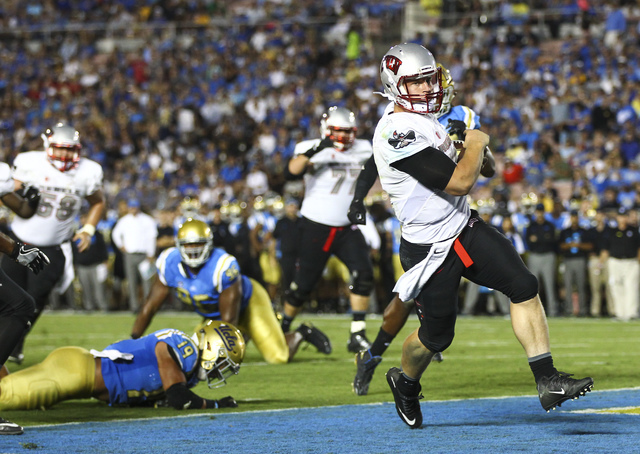 UNLV Rebels quarterback Johnny Stanton (4) scores a touchdown against UCLA during a football game at the Rose Bowl in Pasadena, Calif. on Saturday, Sept. 10, 2016. UCLA won 42-21. Chase Stevens/La ...