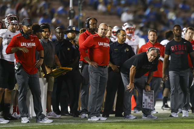 UNLV Rebels head coach Tony Sanchez, center, looks on as his team plays UCLA during a football game at the Rose Bowl in Pasadena, Calif. on Saturday, Sept. 10, 2016. UCLA won 42-21. Chase Stevens/ ...