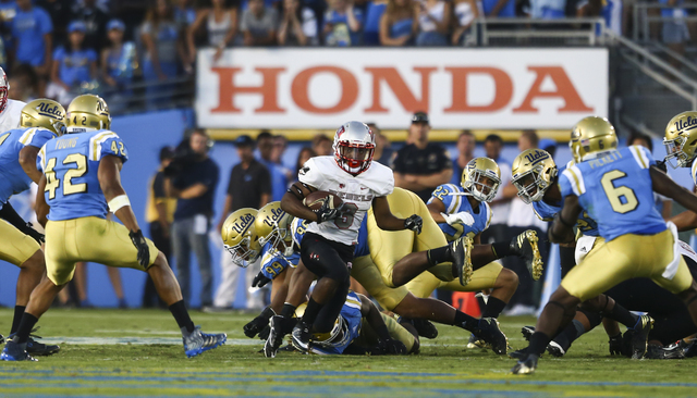 UNLV Rebels running back Lexington Thomas (3) drives the ball against UCLA during a football game at the Rose Bowl in Pasadena, Calif. on Saturday, Sept. 10, 2016. UCLA won 42-21. Chase Stevens/La ...