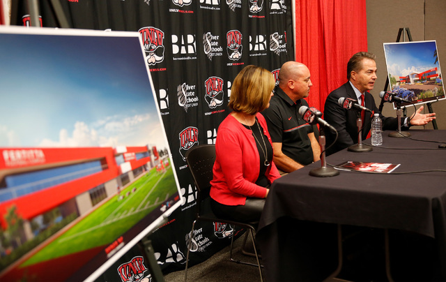 UNLV President Len Jessup, right, speaks during a news conference in Las Vegas, Tuesday, Sept.13, 2016, as Athletics Director Tina Kunzer-Murphy and Coach Tony Sanchez look on. UNLV announced the  ...