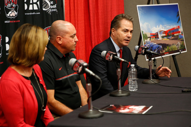 UNLV President Len Jessup, right, speaks during a news conference in Las Vegas, Tuesday, Sept.13, 2016, as Athletics Director Tina Kunzer-Murphy and Coach Tony Sanchez look on. UNLV announced the  ...