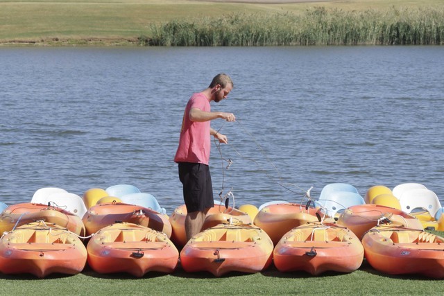 Michael Salerno, lead instructor at Las Vegas Canoe Kayak Club, unlocks kayaks at Lake Las Vegas on Thursday, Sept. 15, 2016, in Henderson. (Bizuayehu Tesfaye/Las Vegas Review-Journal Follow @bizu ...
