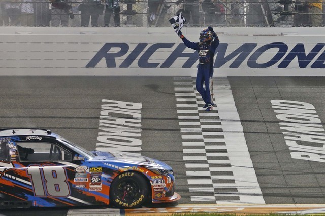 Kyle Busch celebrates his victory in the NASCAR Xfinity auto race at Richmond International Raceway in Richmond, Va., Friday, Sept. 9, 2016. (AP Photo/Steve Helber)