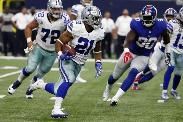 Dallas Cowboys running back Ezekiel Elliott (21) runs the ball for a touchdown as New York Giants defensive end Jason Pierre-Paul (90) pursues in the second half of an NFL football game, Sunday Se ...
